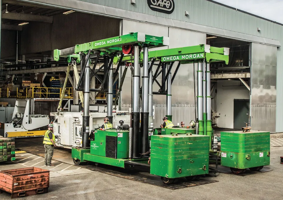 Omega Morgan crew operating heavy forklift equipment on a project site